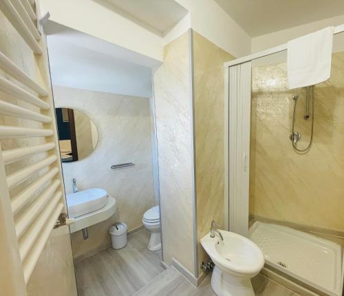 a bathroom with a toilet and a sink and a shower at TibetiAmo in Castelsaraceno