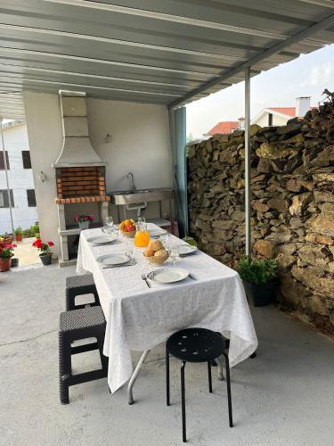 a table with plates of food on top of it at Casa do Sobral in Ponte de Lima