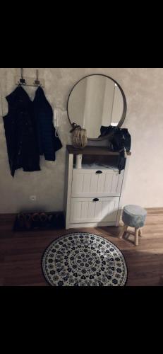 a room with a mirror and a dresser with a rug at Exclusive Garden Oasis with Jacuzzi & Private Parking in Trnava