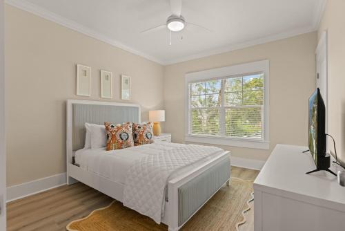 a white bedroom with a bed and a window at Time Flys - 498 Baisden Lane in Mallory Park