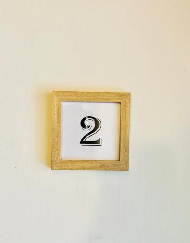 a picture with the number two on a wall at The Hamilton House in Florence