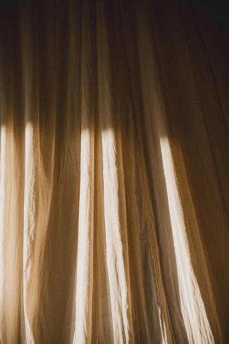 a close up of a window with a curtain at Nivriti Bali in Sidemen