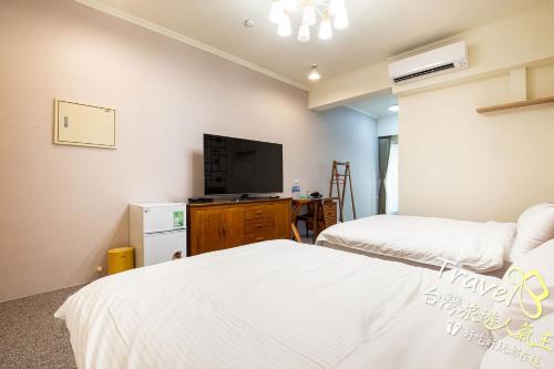Cama o camas de una habitación en 還早文旅