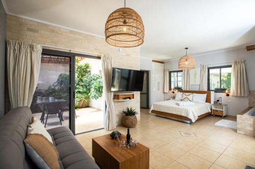 a living room with a couch and a bed at פרדייז ברמה in Had Nes