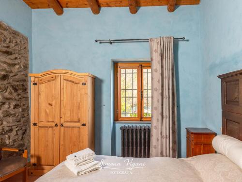 Postel nebo postele na pokoji v ubytování Cascina Capéle