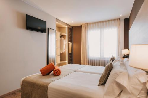 Postel nebo postele na pokoji v ubytování Hotel Windsor Tossa - Adults Only 16