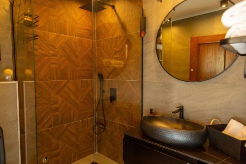 a bathroom with a sink and a mirror at Apartments Milla in Ulcinj