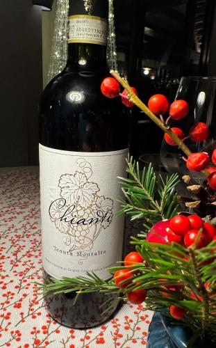 a bottle of wine sitting on top of a table at Agriturismo Cascina Cipressa in San Romano