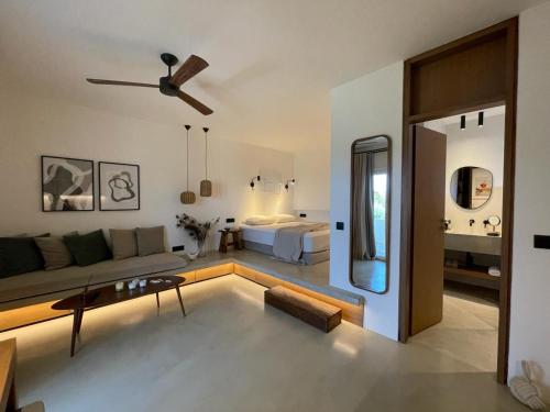 a living room with a couch and a bed at Hideaway Syros in Megas Gialos - Nites