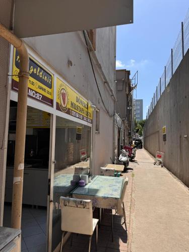 a building with a table and chairs outside of it at Transit 77 in Istanbul