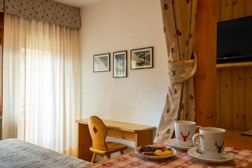 TV a/nebo společenská místnost v ubytování Hotel Vallée Blanche Courmayeur