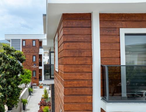 a building with wood panels on the side of it at EURONOVA HOTEL & SUiTES in Kemer