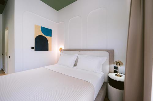 Postel nebo postele na pokoji v ubytování Noemie Hotel