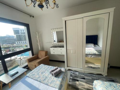 Postel nebo postele na pokoji v ubytování Nyoum Porto New Cairo