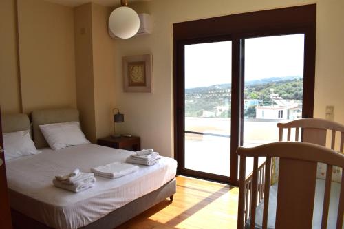 Ένα ή περισσότερα κρεβάτια σε δωμάτιο στο Smaragda's Maisonette