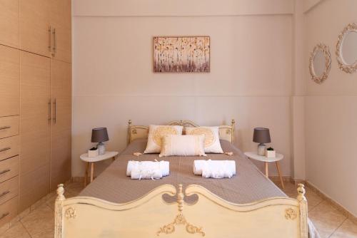 a bedroom with a large bed with two night stands at Greg's House in Vitalades