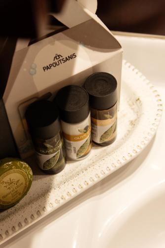 a box of medicines sitting on a plate next to a sink at Greg's House in Vitalades