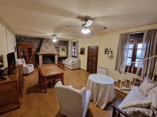 a living room with a couch and a fireplace at Casa Manuel in Herencia