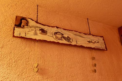 a drawing of a train hanging on a wall at CleMaison Antica Dimora Apartments CIR VDA GIGNOD 0013 in Gignod