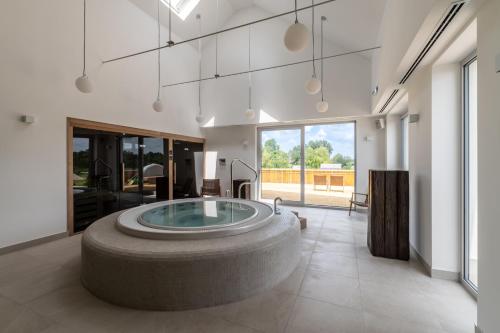 a large bathroom with a large tub in the middle at Katarina Birtok in Nemesnádudvar
