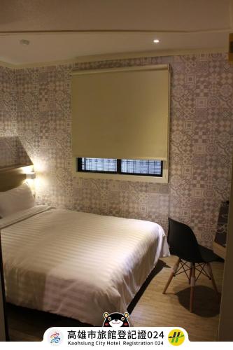 Cama o camas de una habitación en Win Inn Kaohsiung Hotel