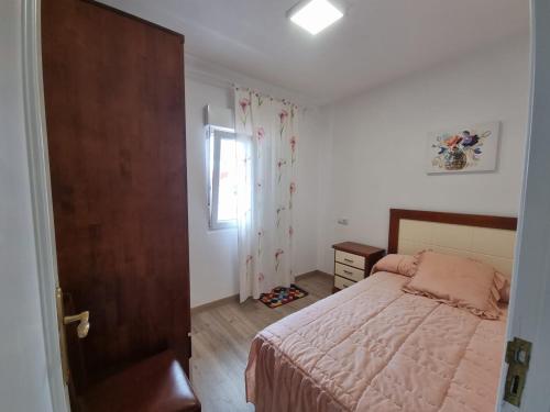 Postel nebo postele na pokoji v ubytování Casa del Carmen