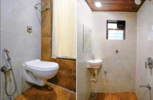 a bathroom with a toilet and a shower and a sink at HOTEL MOON LITE RESIDENCY - Marve Road Malad West in Mumbai