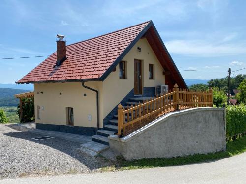 a small white house with a red roof at Vineyard Cottage Joanna in Mirna Peč