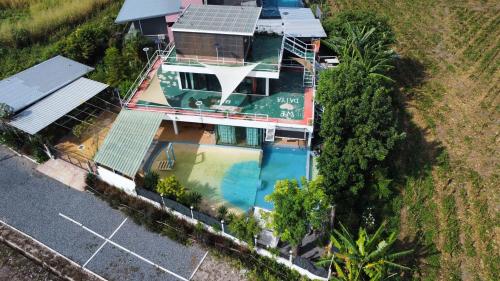 an overhead view of a house with a swimming pool at Daiya Nirvana Pool Villa, Khao Yai in Klang Dong