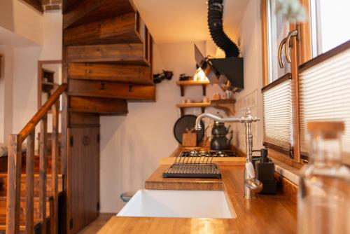 a kitchen with a sink and a counter top at Abant Cozy Homes in Bolu