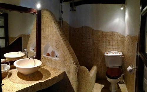 a bathroom with a sink and a toilet at Patmos Chora with a View in Patmos
