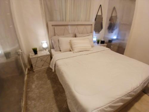 Ένα ή περισσότερα κρεβάτια σε δωμάτιο στο Cozy villa in a compound