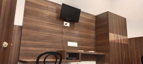 a wall with a flat screen tv on top of it at Hotel Zen in Khajurāho
