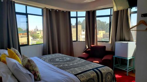 Ένα ή περισσότερα κρεβάτια σε δωμάτιο στο Hotel Ollanta rooftop