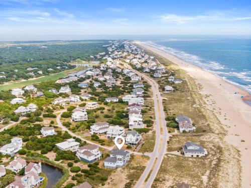 an aerial view of a beach with houses at Jailbreak in Southport