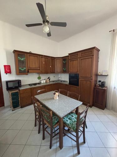 a kitchen with a table with a cat sitting on it at Appartamento VialeMarconi139, San Miniato in San Miniato Basso