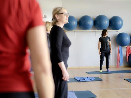 a group of people in a yoga class at Hotel Arezzo ASC in Arezzo