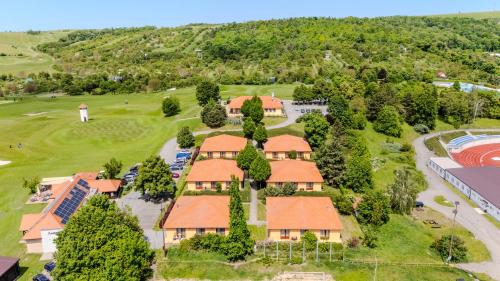 an aerial view of a resort with a golf course at Golf Hotel Austerlitz in Slavkov u Brna