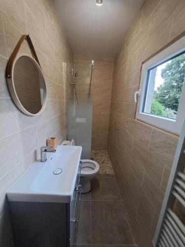 a bathroom with a sink and a toilet and a mirror at T2 Concoules - Panorama, Randonnées, Etapes motards in Concoules