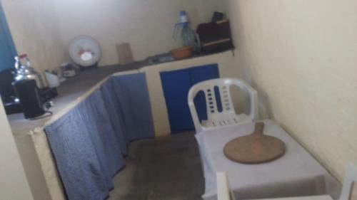a room with a sink with a chair in it at Casa de campo in Al Hoceïma