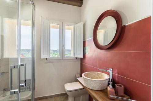 a bathroom with a sink and a mirror at Casale Micale in Noto