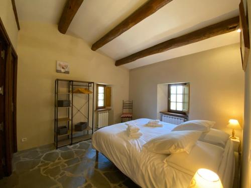 En eller flere senge i et værelse på Les Gîtes de l'Abric