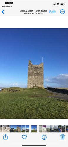 a picture of a castle on a grass field at River View in Quignalahy