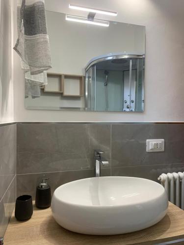 a bathroom with a white sink and a mirror at Il nido dell'aquila-Lugnano in Teverina in Lugnano in Teverina