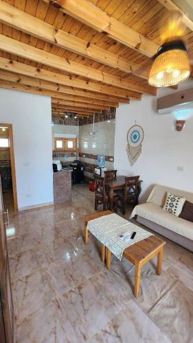 a living room with a couch and a table at Villa Vovan in Dahab