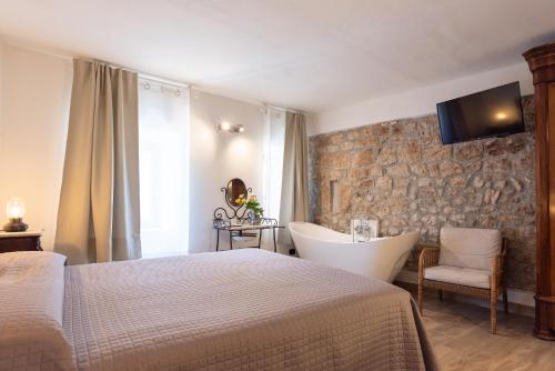 Postel nebo postele na pokoji v ubytování Dimora & Spa Il Cerchio di Lullo