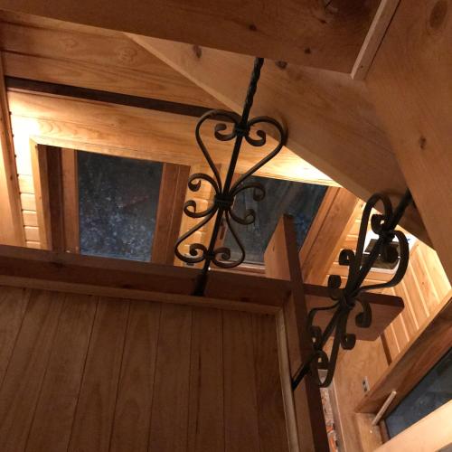 a chandelier hanging from the ceiling of a cabin at Cabañas japonesas en el bosque KURO y AKA in Valdivia