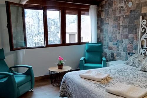 A bed or beds in a room at Alojamientos Rurales Entre Rocas