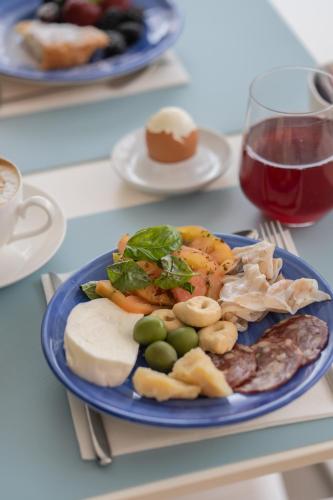 a blue plate of food on a table at Santa Maria Vecchia Relais in Vico Equense