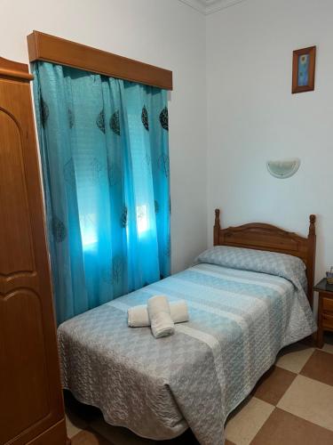 Ένα ή περισσότερα κρεβάτια σε δωμάτιο στο Hostal Andalucia de Arcos